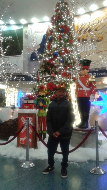 Stephen posing by Christmas Tree